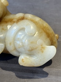 A large Chinese white and russet jade sculpture of a mythical beast, 17/18th C.