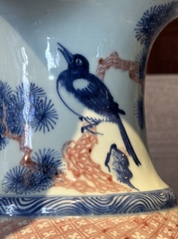 A fine Chinese blue, white and copper-red 'magpie and pine tree' vase, Yongzheng/Qianlong
