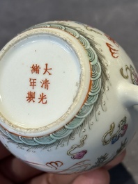Two Chinese famille rose vases, two teapots and a Japanese wucai ewer, 19th C.