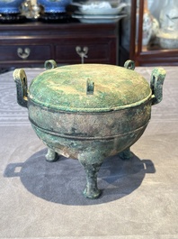 A Chinese archaic bronze tripod vessel and cover, 'ding 鼎', Eastern Zhou, Spring and Autumn period