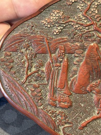 A Chinese quadrifoil red cinnabar lacquer box and cover with figural design, 19/20th C.