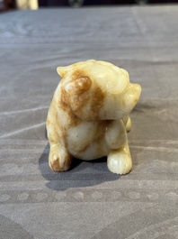 A large Chinese white and russet jade sculpture of a mythical beast, 17/18th C.