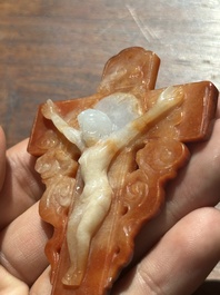 A Chinese white and red jade 'crucifix' pendant, 19th C.