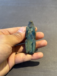 A rare Chinese gold and silver-inlaid bronze paperweight in the shape of a tapir '貘', Warring States period
