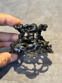 A Chinese famille rose cup with a boy and a rooster on wooden base, Qianlong mark, 20th C.