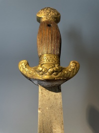 A silver plated dagger and four swords, China, Burma and Indonesia, 18/19th C.