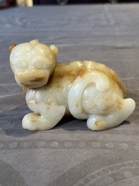 A large Chinese white and russet jade sculpture of a mythical beast, 17/18th C.