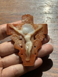 A Chinese white and red jade 'crucifix' pendant, 19th C.