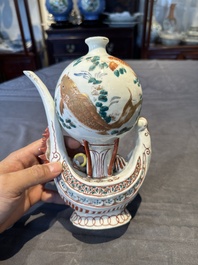 Two Chinese famille rose vases, two teapots and a Japanese wucai ewer, 19th C.