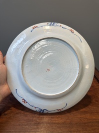 A Dutch Delft Imari-style dish with antiquities, 'AK' mark, 18th C.