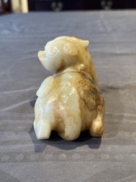 A large Chinese white and russet jade sculpture of a mythical beast, 17/18th C.