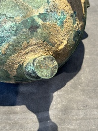 A Chinese archaic bronze tripod vessel and cover, 'ding 鼎', Eastern Zhou, Spring and Autumn period