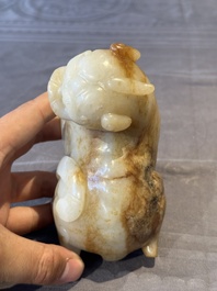 A large Chinese white and russet jade sculpture of a mythical beast, 17/18th C.