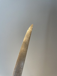 A silver plated dagger and four swords, China, Burma and Indonesia, 18/19th C.