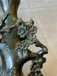 A Chinese bronze vase in the shape of a prunus, Ming