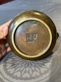 A Chinese bronze censer with lion handles, Xuande mark, 17/18th C.