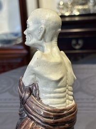 A fine Chinese sancai-glazed figure of a Luohan, Qianlong