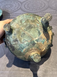 A Chinese archaic bronze tripod vessel and cover, 'ding 鼎', Eastern Zhou, Spring and Autumn period