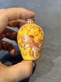 A Chinese jade snuff bottle and a yellow-ground iron-red snuff bottle, Daoguang mark, 19th C.