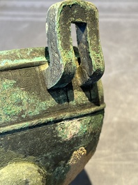 A Chinese archaic bronze tripod vessel and cover, 'ding 鼎', Eastern Zhou, Spring and Autumn period
