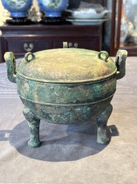 A Chinese archaic bronze tripod vessel and cover, 'ding 鼎', Eastern Zhou, Spring and Autumn period