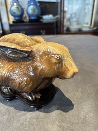A fine Chinese cafe-au-lait glazed hare on wooden stand, Tian 天 mark, Qing