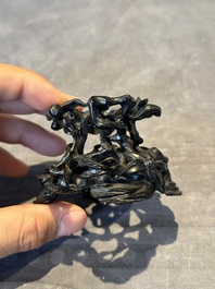 A Chinese famille rose cup with a boy and a rooster on wooden base, Qianlong mark, 20th C.