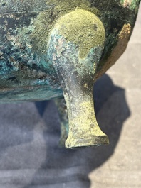 A Chinese archaic bronze tripod vessel and cover, 'ding 鼎', Eastern Zhou, Spring and Autumn period