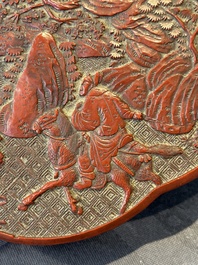 A Chinese quadrifoil red cinnabar lacquer box and cover with figural design, 19/20th C.