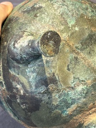 A Chinese archaic bronze tripod vessel and cover, 'ding 鼎', Eastern Zhou, Spring and Autumn period