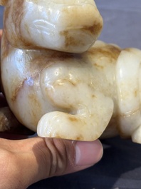 A large Chinese white and russet jade sculpture of a mythical beast, 17/18th C.