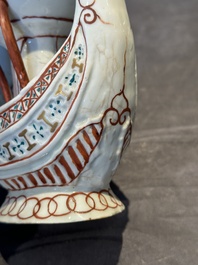 Two Chinese famille rose vases, two teapots and a Japanese wucai ewer, 19th C.