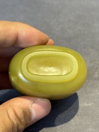 A Chinese yellow jade snuff bottle with moss agate cover and bone stopper, 19th C.