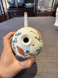 Two Chinese famille rose vases, two teapots and a Japanese wucai ewer, 19th C.