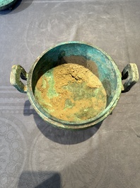 A Chinese archaic bronze tripod vessel and cover, 'ding 鼎', Eastern Zhou, Spring and Autumn period