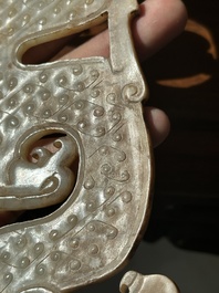 A Chinese nephrite jade ark-shaped 'chilong' plaque, Zhou/Han
