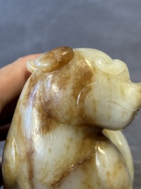 A large Chinese white and russet jade sculpture of a mythical beast, 17/18th C.