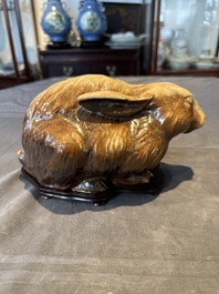A fine Chinese cafe-au-lait glazed hare on wooden stand, Tian 天 mark, Qing