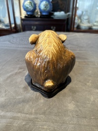 A fine Chinese cafe-au-lait glazed hare on wooden stand, Tian 天 mark, Qing