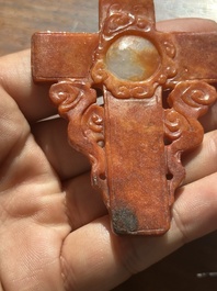 A Chinese white and red jade 'crucifix' pendant, 19th C.