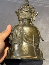 A Chinese bronze Guanyin, Ming and a Tibetan polychrome plaster relief, 19th C.
