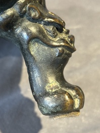 A large Chinese bronze censer and cover with a Buddhist lion, Ming