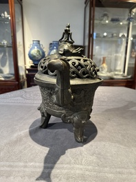 A Chinese bronze 'elephant' tripod censer and cover, Ming
