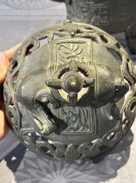 A Chinese bronze 'elephant' tripod censer and cover, Ming