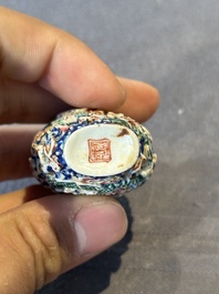 Five Chinese moulded famille rose snuff bottles, Qianlong mark, 19th C.