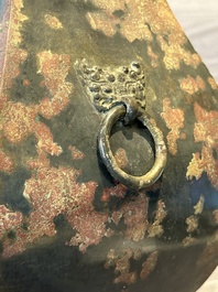 A Chinese archaic bronze vase with 'Taotie' handles, 'fang hu 方壺', Han