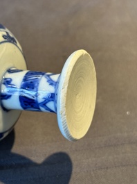 A Chinese blue and white stem cup with scholars in a landscape, Transitional period