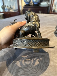 A large Chinese bronze censer and cover with a Buddhist lion, Ming