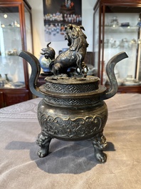 A large Chinese bronze censer and cover with a Buddhist lion, Ming