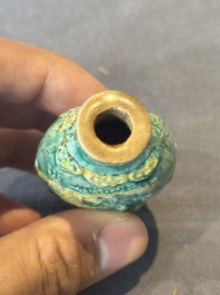 Five Chinese moulded famille rose snuff bottles, Qianlong mark, 19th C.